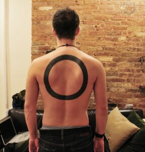 large-circle-tattoo-on-back